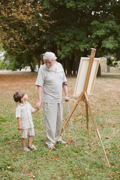 Grandson with grandpa holding hands