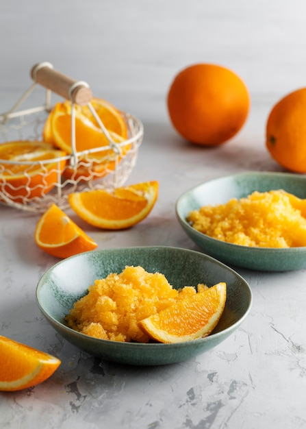 Granita dessert with orange still life high angle