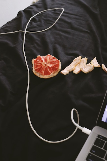 Grapefruit on a black cloth