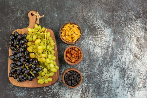 grapes bowls of dried fruits bunches of the appetizing grapes