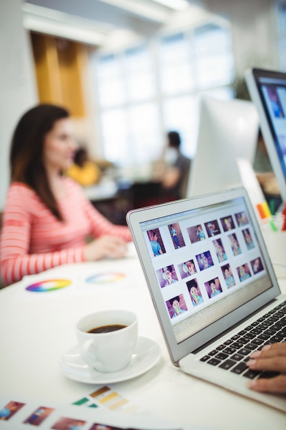 Free photo graphic designers working at their desk