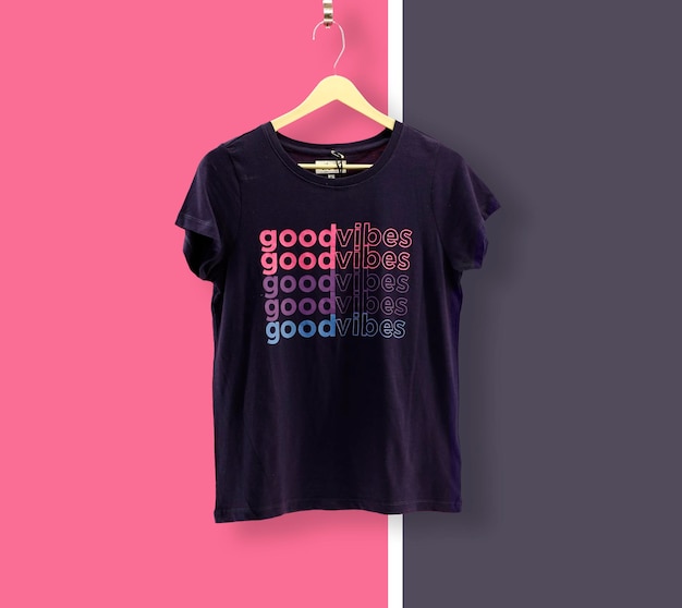 Free photo graphic tshirt trendy design mockup presented on wooden hanger