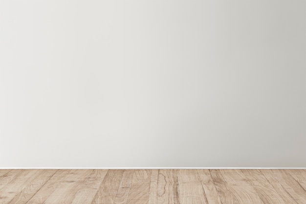 Gray blank concrete wall mockup with a wooden floor