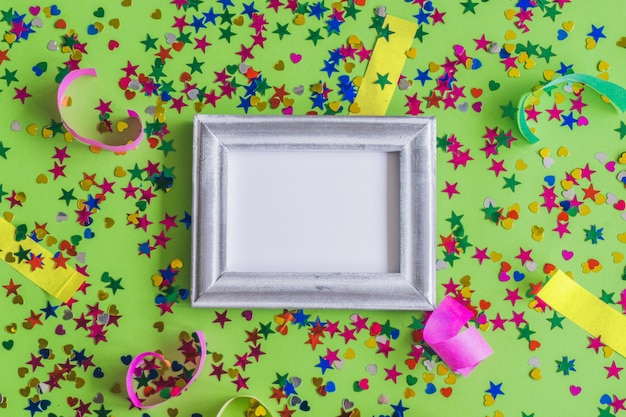 Gray photo frame with confetti and colored strips