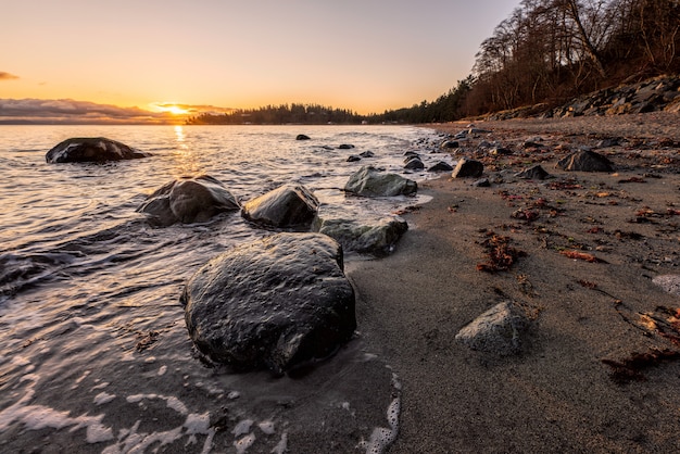 Free Photo gray rocks on seashore during sunset