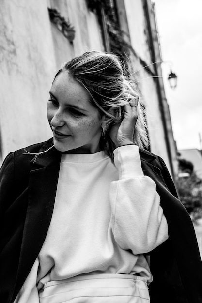 Free Photo grayscale photo of woman holding her hair