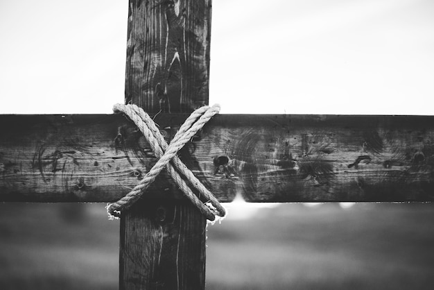 Free Photo a grayscale shot of a handmade wooden cross