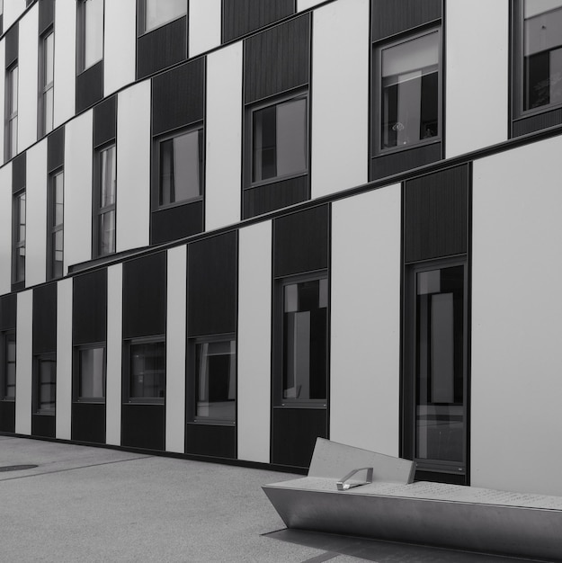 Grayscale shot of a striped apartment building