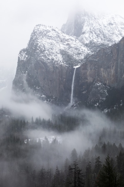 Grayscale shot of a  waterfall in Yosemite National Park in California