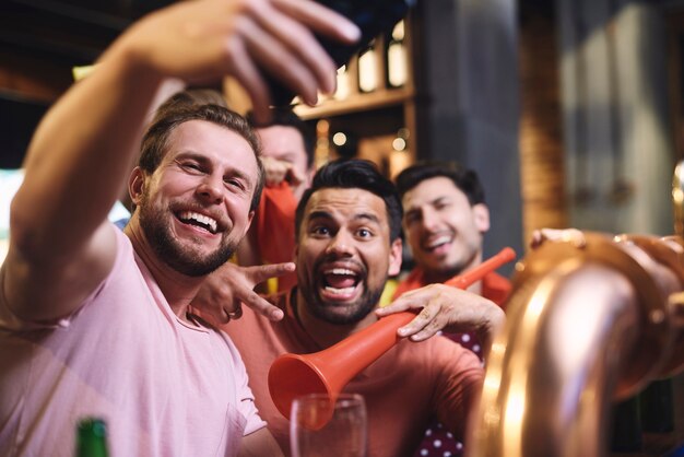 Great selfie of cheerful group of friends