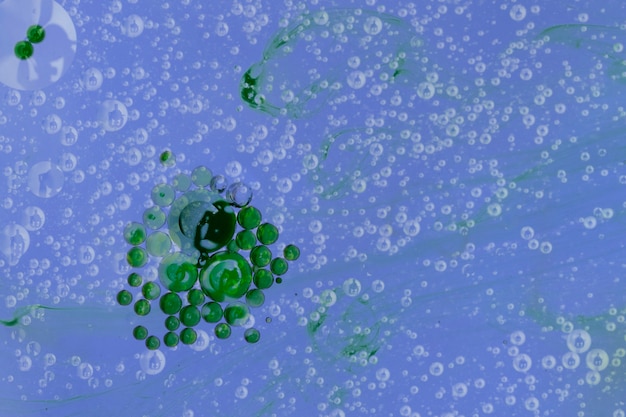 Free photo green bubble archipelago with blue droplets