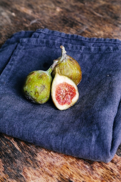 Green fig on rustic table