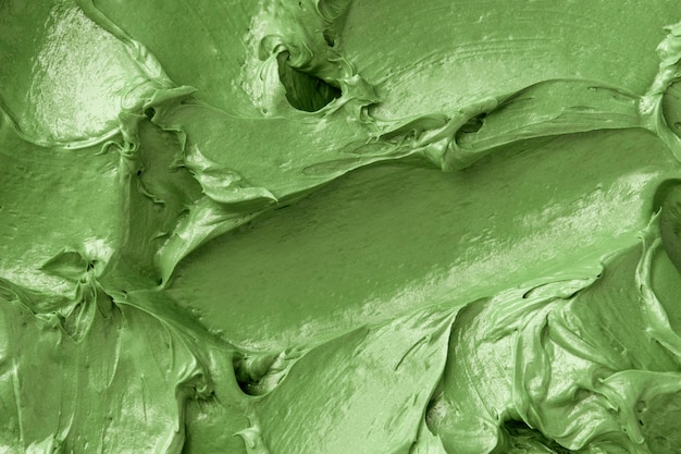 Free photo green frosting texture background close-up