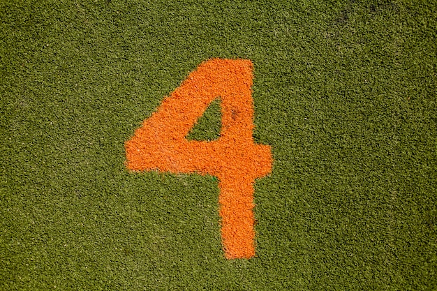 Green grass texture with number four