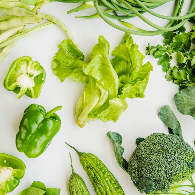 Green healthy vegetables on white backdrop