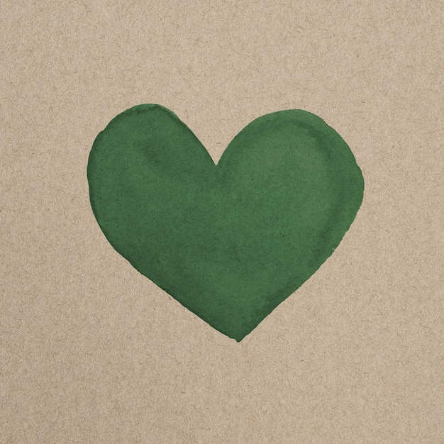 Free photo green heart inside eco-friendly brown paperboard