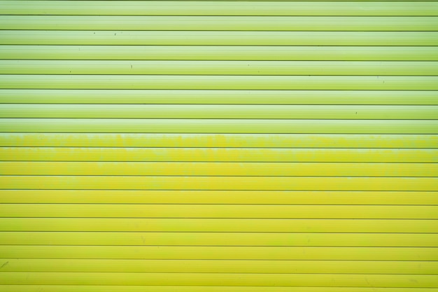 Green iron tin fence lined background. Metal texture