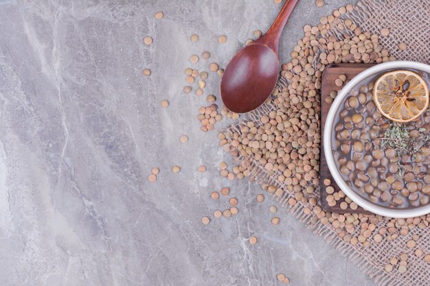 Green lentil beans soup in a white bowl