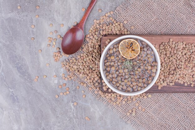 Green lentil soup in a white bowl with spices