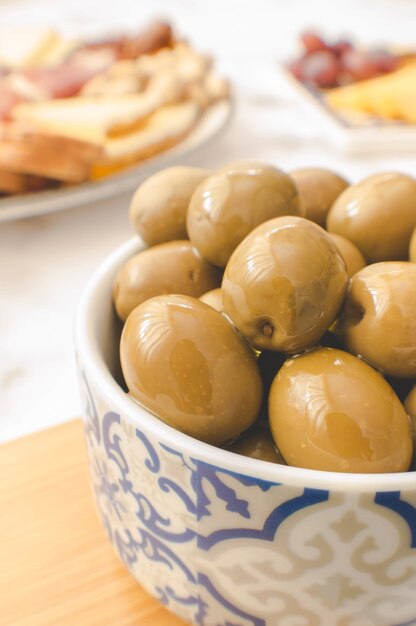 Green olives served in a bowl for a brunch