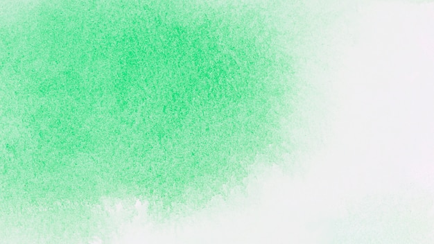 Free photo green paints on white paper