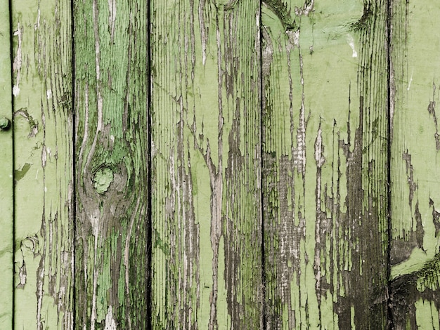 Free photo green peeled paint of wooden plank texture