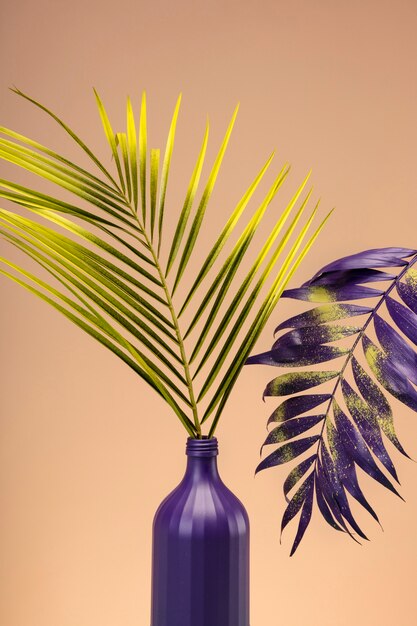 Green and purple exotic leaves still life