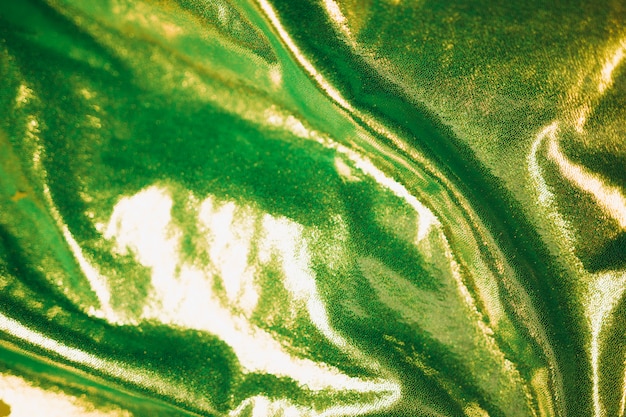 Free Photo green shiny fabric in background