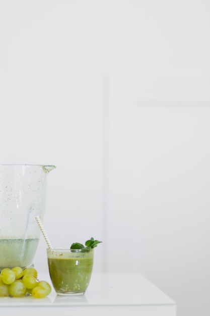 Green smoothie drink on table