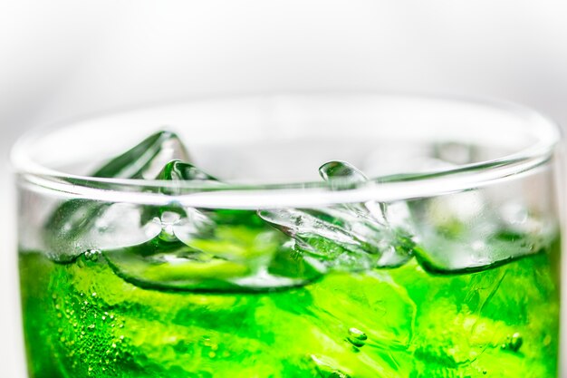 Green soda drink macro shot