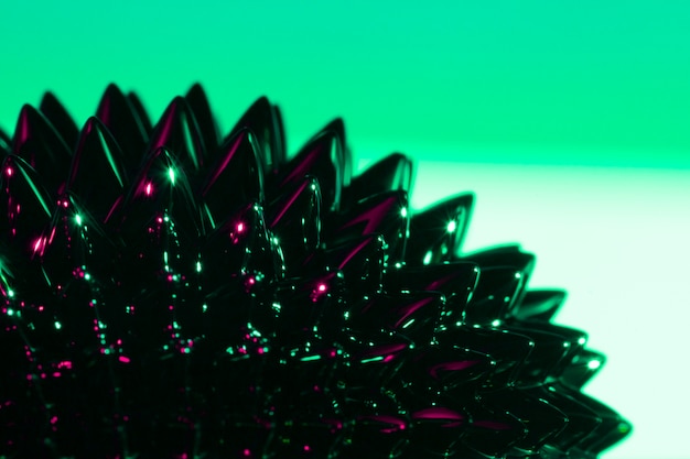 Free Photo green and spiky ferromagnetic liquid metal with copy space