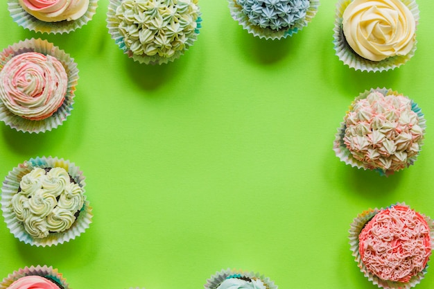 Green surface with assortment of muffins