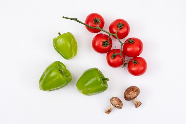 Green sweet peppers, tomatoes and mushrooms