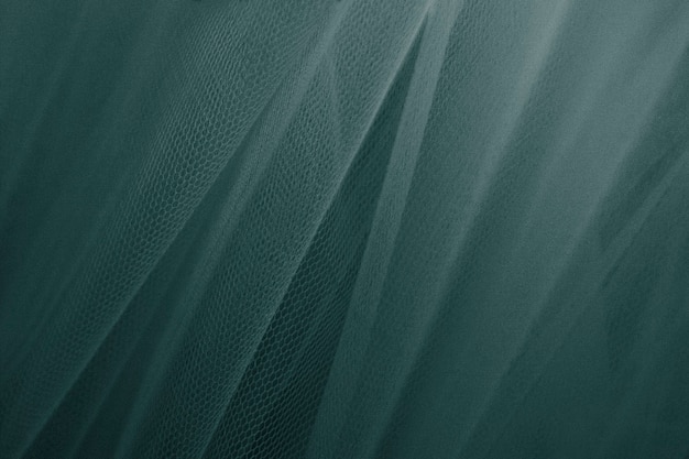 Green tulle drapery textured background