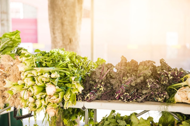 Free Photo green vegetables arranged in market for sale