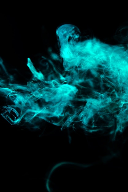 Green wavy smoke on black background