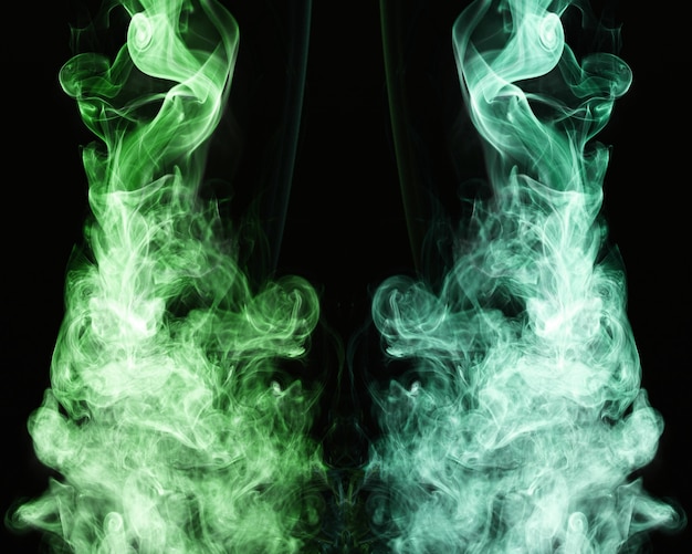 Free photo green wavy smoke on black background