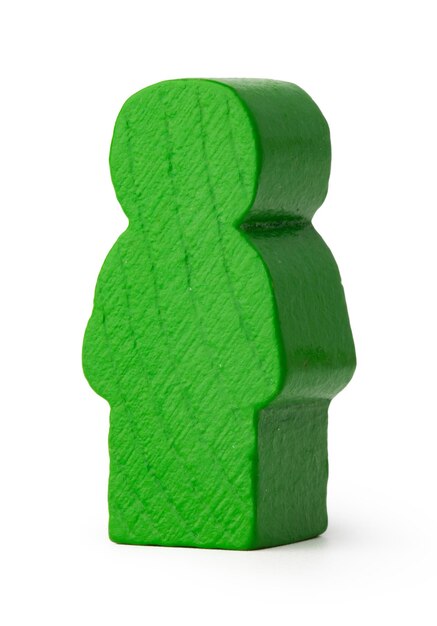 Green wooden toy figure of man isolated on white