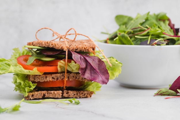 Free Photo greenary salad with sandwich