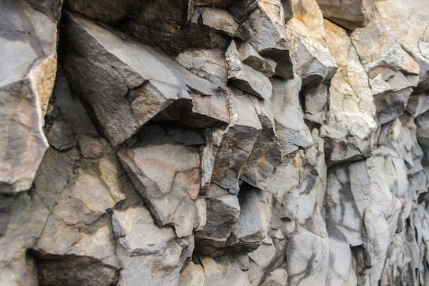 Grey basalt columns near Reynisdrangar beach, Iceland .