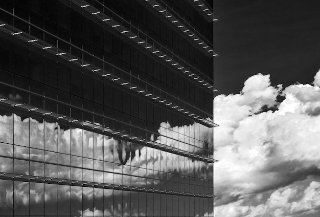 Greyscale  clouds reflection in a building