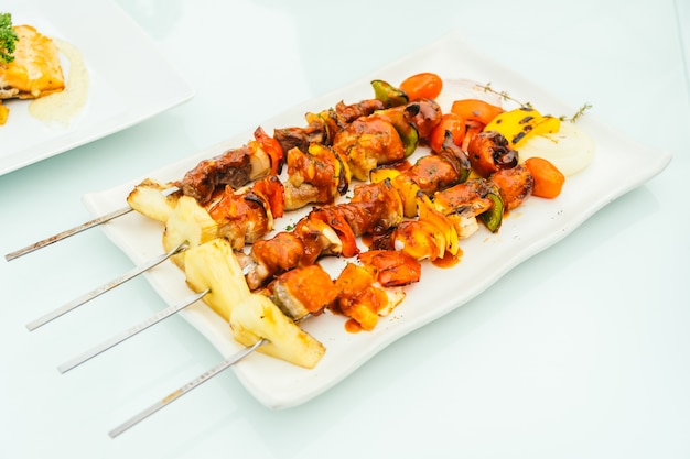 Grilled bbq meat stick in white plate