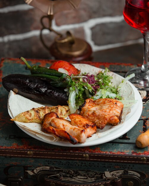 Grilled chicken with tomato,eggplant and herbs.