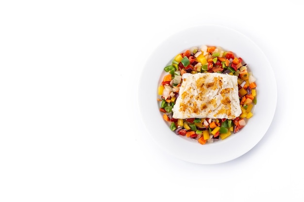 Grilled cod with vegetables in plate isolated on white background