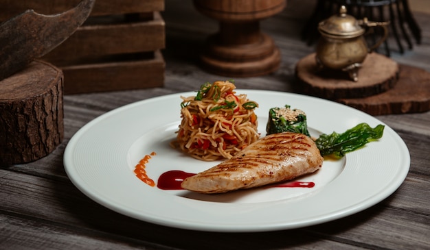 Free Photo grilled fish fillet with spaghetti in tomato sauce