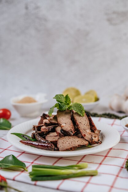 Grilled Liver Slices with sliced ÃÂÃÂ¢ÃÂÃÂÃÂÃÂÃÂÃÂ¢ÃÂÃÂÃÂÃÂlime, carrots, chili, spring onions, and mint.