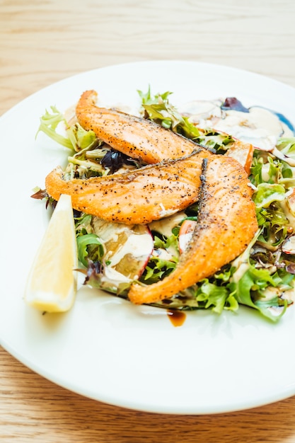 Grilled salmon fillet meat with vegetable salad