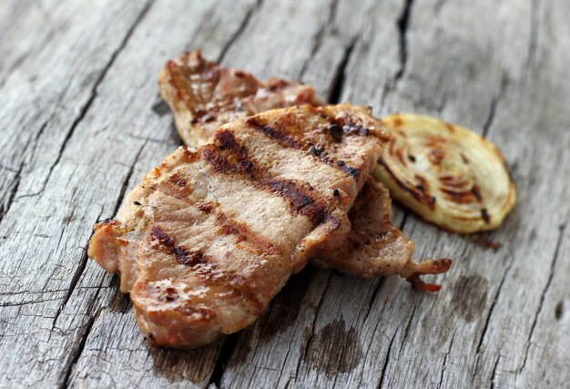 Grilled steak on wooden table