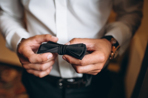 Free photo groom's wedding bow tie