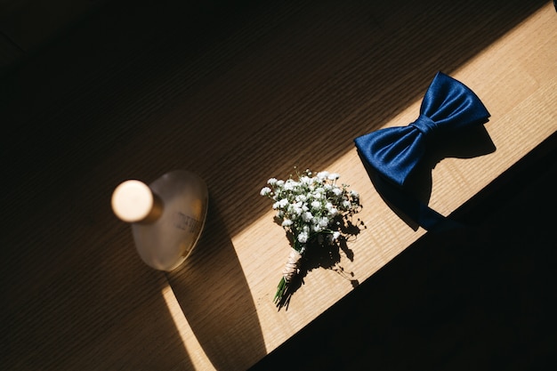 Free photo groom's wedding details lie on a table